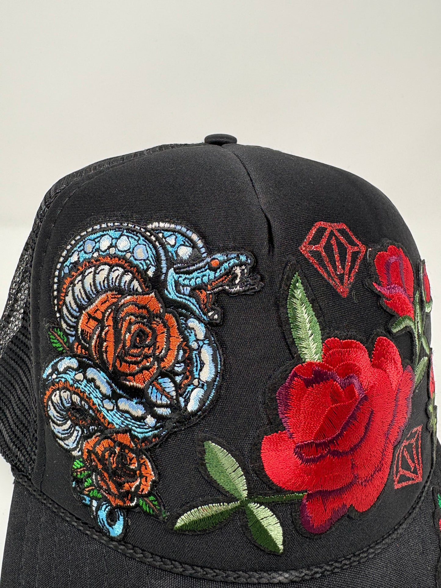 “Year of the snake” trucker hat