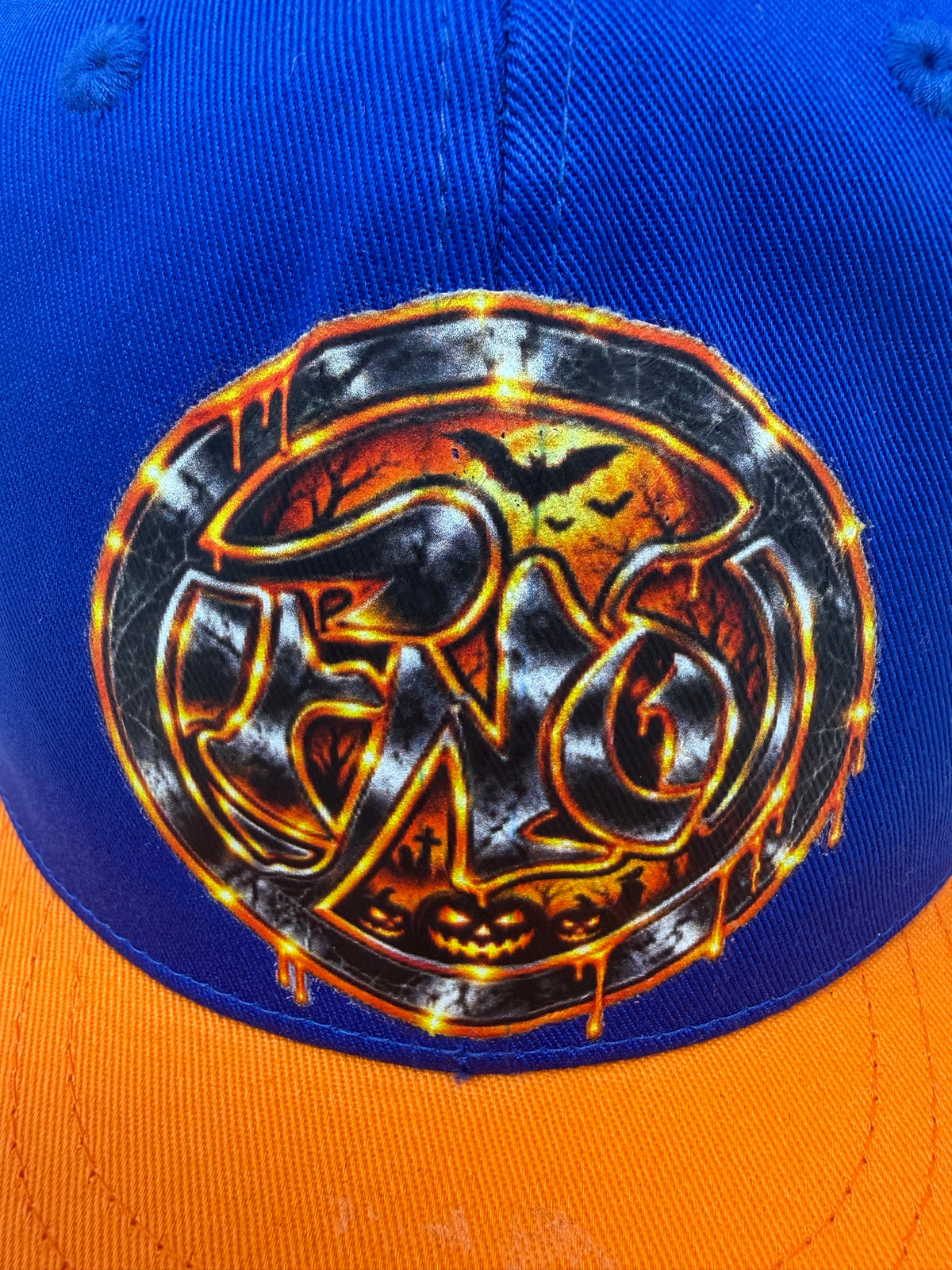 Haunted fearless dojo SnapBack (blue & orange)