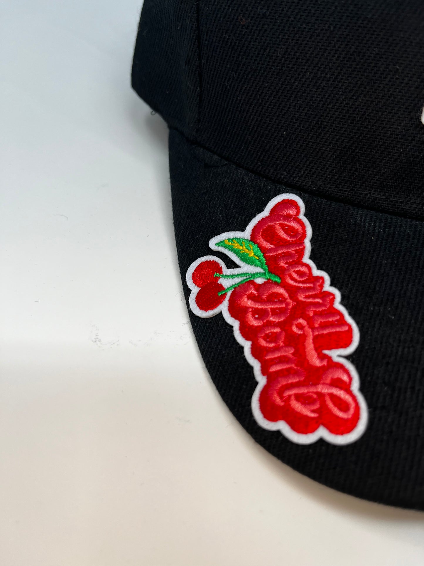 Cherry diamonds cap