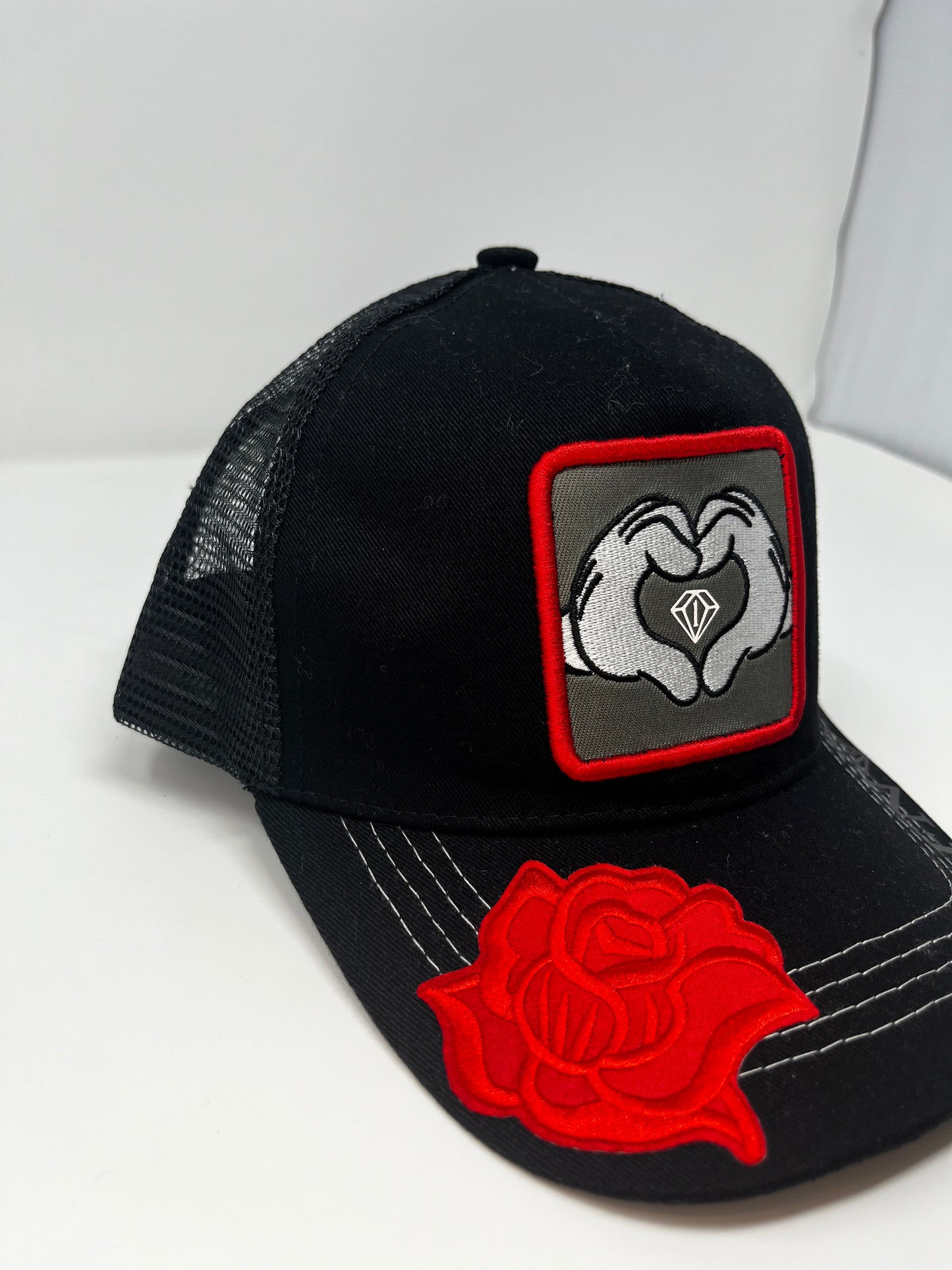 Hearts n diamonds cartoon hands trucker hat