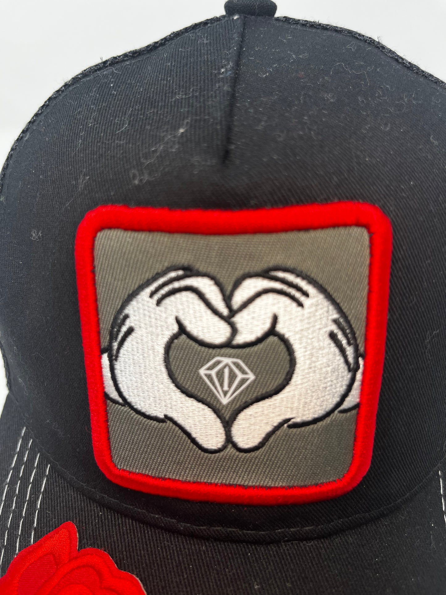 Hearts n diamonds cartoon hands trucker hat