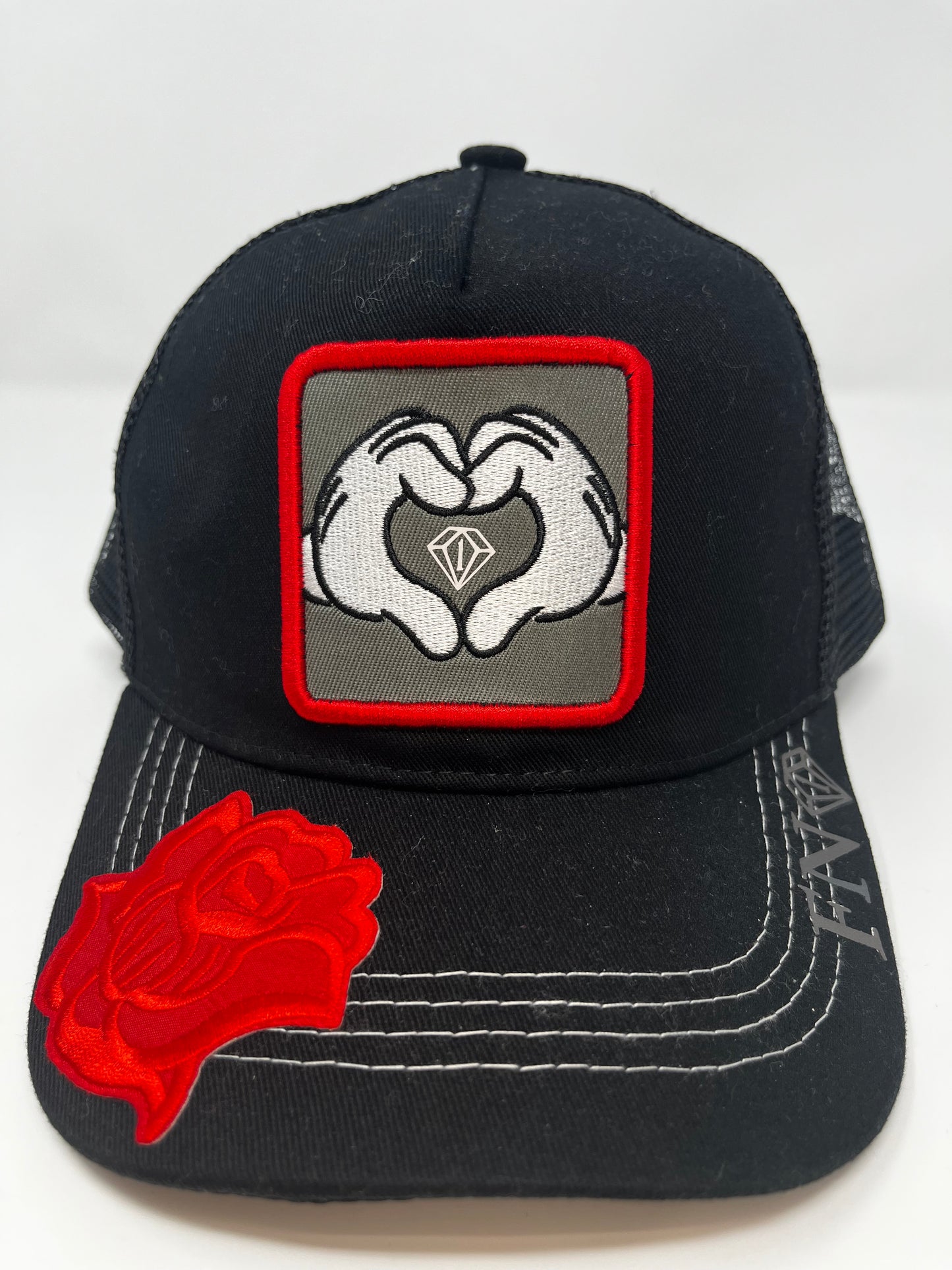 Hearts n diamonds cartoon hands trucker hat